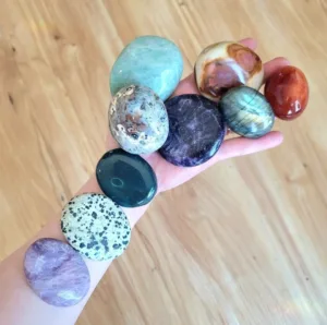 various palm stones, lepidolite, dalmation stone, bloodstone, ocean jasper, amazonite, labradorite, carnelian and polychrome jasper