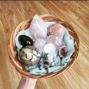 assorted spring-themed crystals - rainbow obsidian, rose quartz, pink amethyst, selenite, pink tourmaline, septarian egg, peach moonstone heart