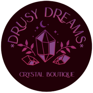 Shop Logo Drusy Dreams Crystal Boutique over a crystal and leaf motif